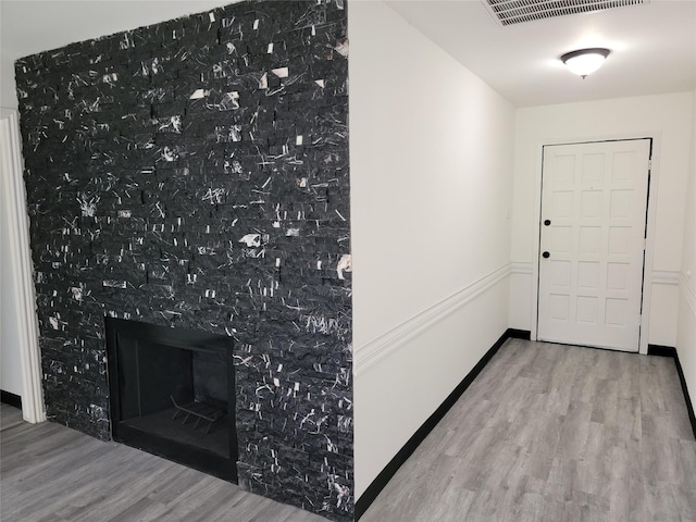 5814 Fontenelle Dr, Houston, TX 77035 - entryway featuring wood finished floors and a premium fireplace