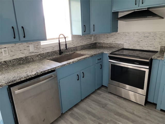 5814 Fontenelle Dr, Houston, TX 77035 - kitchen featuring stainless steel appliances, blue cabinetry, and a sink