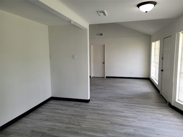5814 Fontenelle Dr, Houston, TX 77035 - unfurnished room featuring baseboards, wood finished floors, and lofted ceiling