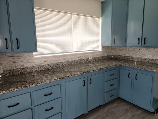 5814 Fontenelle Dr, Houston, TX 77035 - kitchen featuring blue cabinetry, tasteful backsplash, and dark wood-style floors