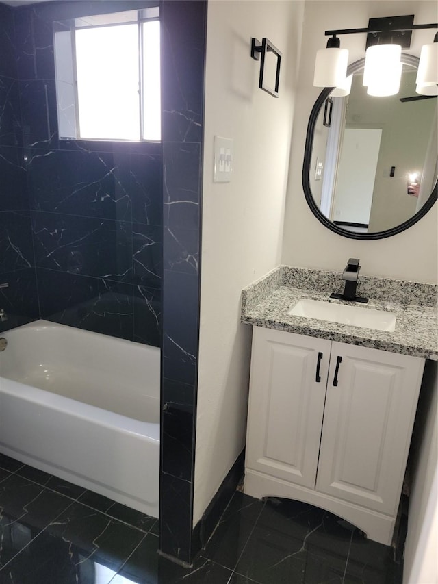 5814 Fontenelle Dr, Houston, TX 77035 - full bath with vanity, tub / shower combination, and marble look tiles