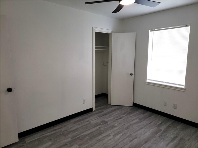 5814 Fontenelle Dr, Houston, TX 77035 - unfurnished bedroom with wood finished floors, a closet, baseboards, and ceiling fan