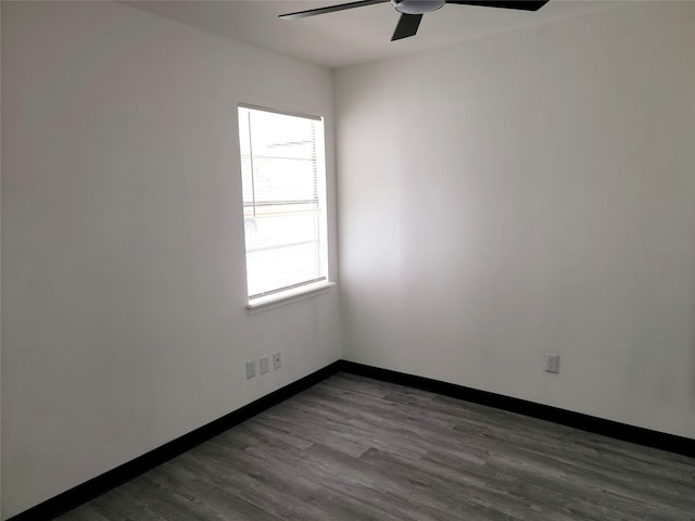 5814 Fontenelle Dr, Houston, TX 77035 - spare room featuring ceiling fan, dark wood-style flooring, and baseboards
