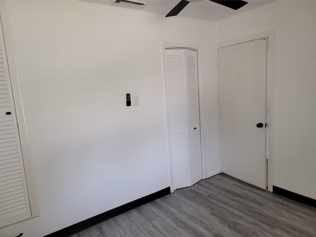 5814 Fontenelle Dr, Houston, TX 77035 - unfurnished bedroom with wood finished floors, a closet, and a ceiling fan