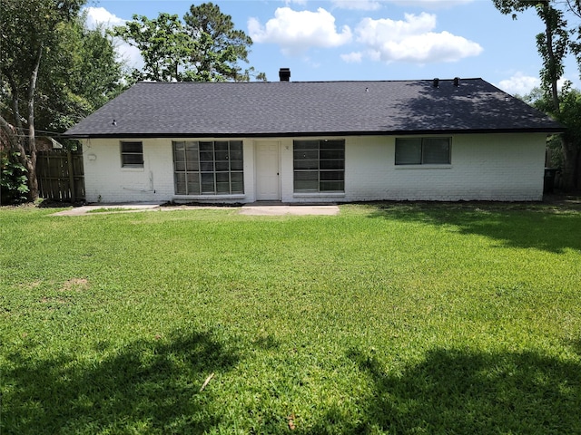 5814 Fontenelle Dr, Houston, TX 77035 - rear view of house featuring brick siding, roof with shingles, and a patio