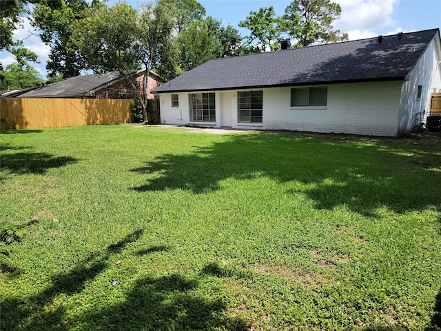 5814 Fontenelle Dr, Houston, TX 77035 - rear view of property with a shingled roof, brick siding, and cooling unit