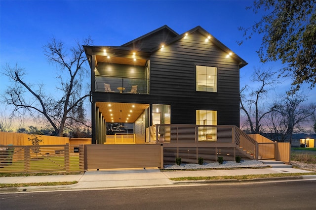 3111 Eastman St, Houston, TX 77022 - modern home featuring a balcony, a gate, and stairway