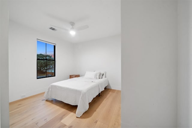 3111 Eastman St, Houston, TX 77022 - bedroom with light wood-style floors, baseboards, and ceiling fan