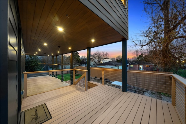 3111 Eastman St, Houston, TX 77022 - deck at dusk with a fenced backyard