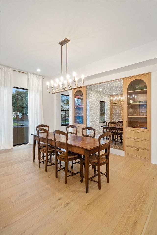 3111 Eastman St, Houston, TX 77022 - dining room featuring a chandelier and light wood-type flooring