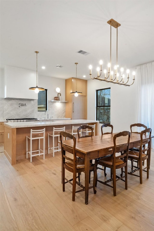 3111 Eastman St, Houston, TX 77022 - dining space featuring light wood-style floors, healthy amount of natural light, and recessed lighting