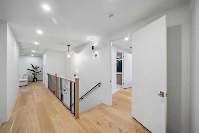 3111 Eastman St, Houston, TX 77022 - hall with attic access, an upstairs landing, light wood finished floors, recessed lighting, and baseboards