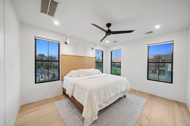 3111 Eastman St, Houston, TX 77022 - bedroom featuring multiple windows, light wood finished floors, recessed lighting, and ceiling fan
