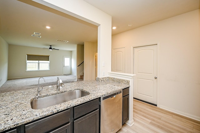 405 Elaine Valley Dr Unit D, Katy, TX 77493 - kitchen with dishwasher, a sink, a ceiling fan, light stone countertops, and light wood-style floors