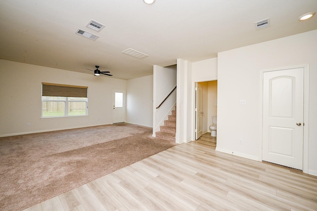 405 Elaine Valley Dr Unit D, Katy, TX 77493 - empty room featuring stairway, ceiling fan, light wood finished floors, baseboards, and recessed lighting