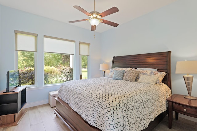 17772 W Terrace Oaks, Waller, TX 77484 - bedroom featuring light wood-style floors, baseboards, and ceiling fan