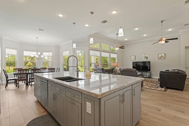 17772 W Terrace Oaks, Waller, TX 77484 - kitchen with a sink, dishwasher, a ceiling fan, gray cabinetry, and a chandelier