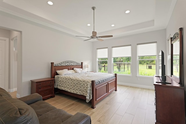 17772 W Terrace Oaks, Waller, TX 77484 - bedroom with recessed lighting, baseboards, light wood-type flooring, a raised ceiling, and a ceiling fan