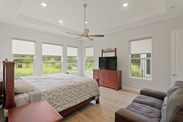 17772 W Terrace Oaks, Waller, TX 77484 - bedroom featuring a tray ceiling, recessed lighting, light wood-style flooring, baseboards, and a ceiling fan