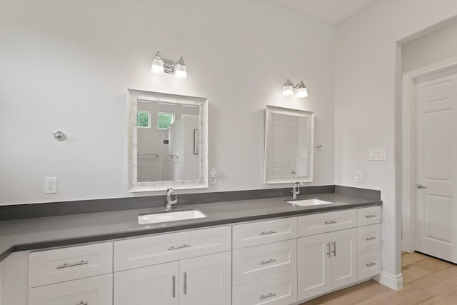 17772 W Terrace Oaks, Waller, TX 77484 - bathroom with double vanity and wood finished floors