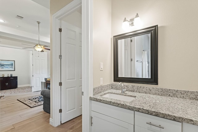 17772 W Terrace Oaks, Waller, TX 77484 - bathroom featuring vanity, wood finished floors, and a ceiling fan