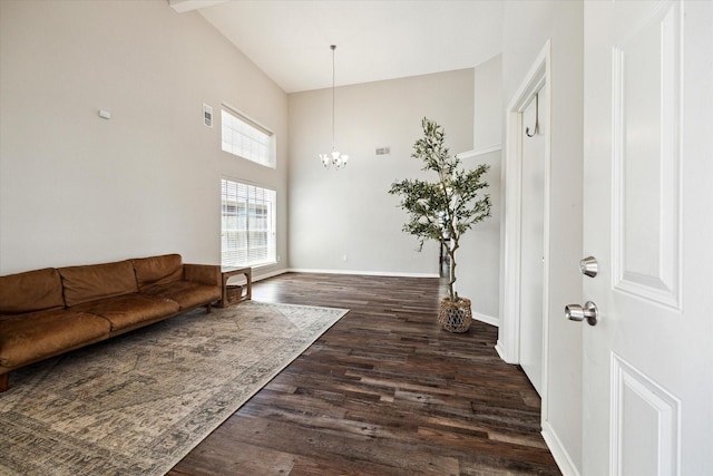 21326 Wildcroft Dr, Katy, TX 77449 - living room with a chandelier, high vaulted ceiling, dark wood-style flooring, and baseboards