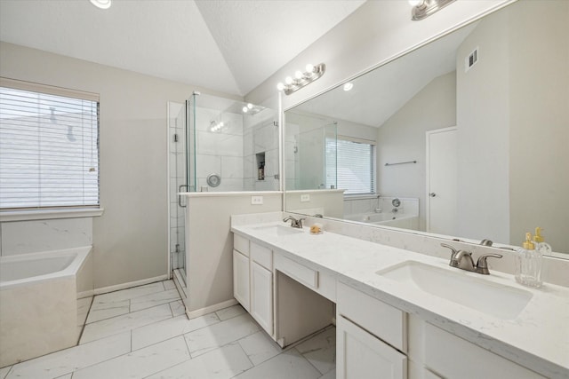21326 Wildcroft Dr, Katy, TX 77449 - full bath featuring lofted ceiling, marble look tiles, a bath, double vanity, and a stall shower