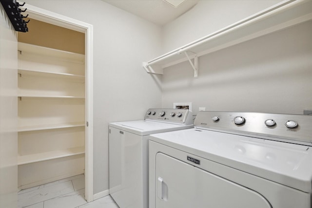 21326 Wildcroft Dr, Katy, TX 77449 - laundry area with light marble finish floors, independent washer and dryer, and baseboards