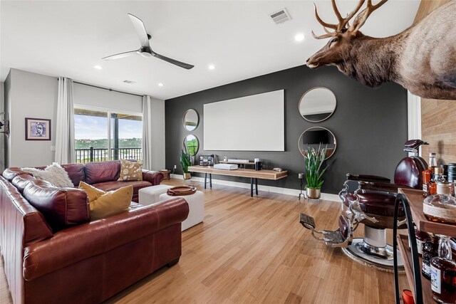 20107 Continental Dr Unit A, Lago Vista, TX 78645 - home theater room with ceiling fan, light wood-type flooring, and recessed lighting