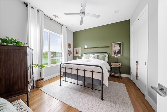 20107 Continental Dr Unit A, Lago Vista, TX 78645 - bedroom featuring wood finished floors and ceiling fan