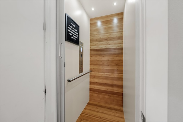 20107 Continental Dr Unit A, Lago Vista, TX 78645 - elevator with wooden walls, recessed lighting, and wood finished floors