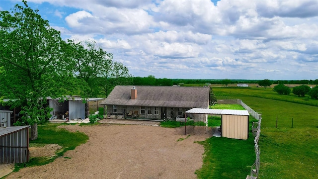 7523 State Highway 21 W, Caldwell, TX 77836 - view of front of home with an outbuilding, a chimney, and dirt driveway