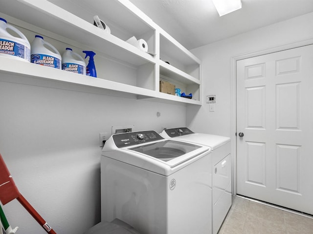 14402 Cottage Timbers Ln, Houston, TX 77044 - laundry room with separate washer and dryer and light tile patterned flooring