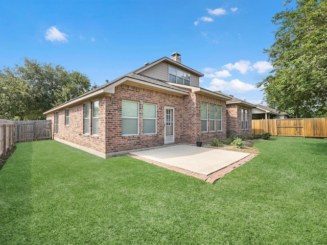 14402 Cottage Timbers Ln, Houston, TX 77044 - back of house with brick siding, a patio area, and a chimney