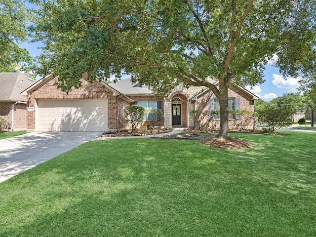 14402 Cottage Timbers Ln, Houston, TX 77044 - view of front of property with an attached garage, driveway, a front yard, and brick siding