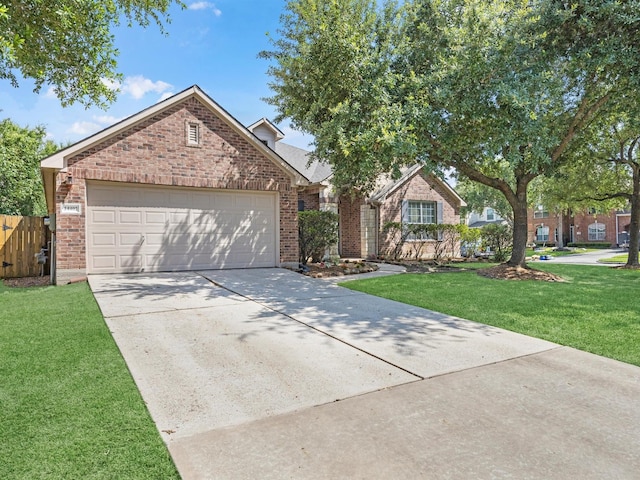 14402 Cottage Timbers Ln, Houston, TX 77044 - traditional-style house featuring brick siding, driveway, and an attached garage