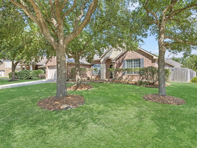 14402 Cottage Timbers Ln, Houston, TX 77044 - view of front of home with brick siding, an attached garage, and concrete driveway