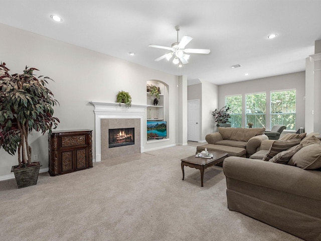 14402 Cottage Timbers Ln, Houston, TX 77044 - living area featuring carpet, a tiled fireplace, ceiling fan, recessed lighting, and baseboards