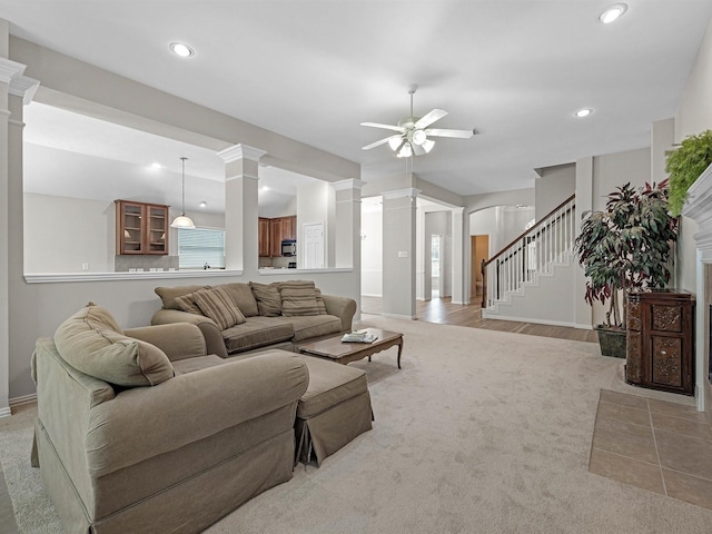 14402 Cottage Timbers Ln, Houston, TX 77044 - living area with decorative columns, ceiling fan, light carpet, and recessed lighting