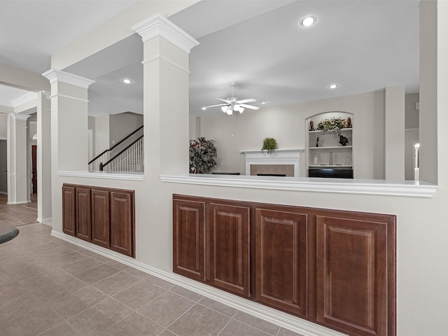 14402 Cottage Timbers Ln, Houston, TX 77044 - bar area featuring ceiling fan, decorative columns, tile patterned flooring, a tile fireplace, and recessed lighting