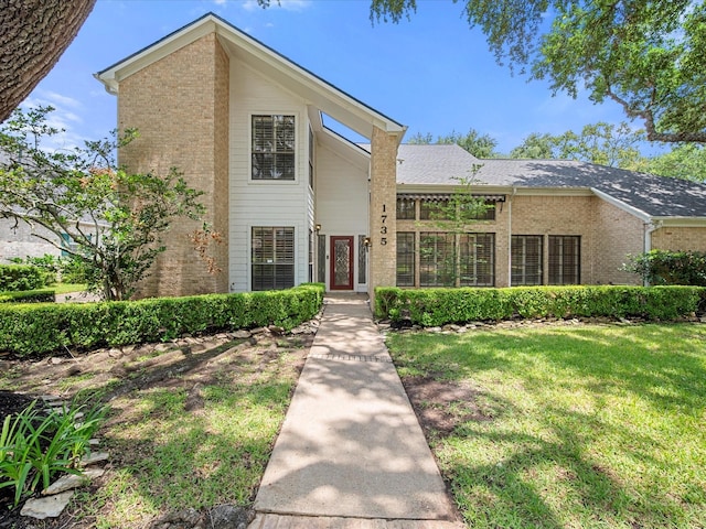 1735 Hodge Lake Ln, Sugar Land, TX 77478 - view of front of home featuring brick siding and a front lawn
