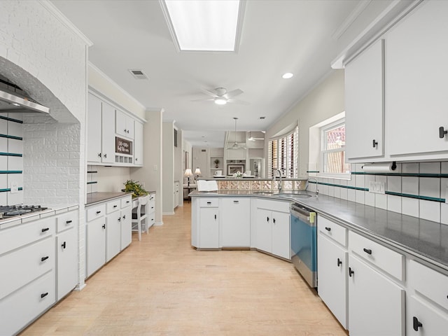 1735 Hodge Lake Ln, Sugar Land, TX 77478 - kitchen with stainless steel dishwasher, decorative backsplash, white cabinetry, a ceiling fan, and recessed lighting