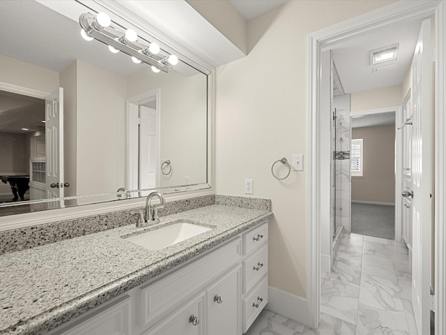 1735 Hodge Lake Ln, Sugar Land, TX 77478 - full bathroom featuring marble look tiles, baseboards, vanity, and a shower stall
