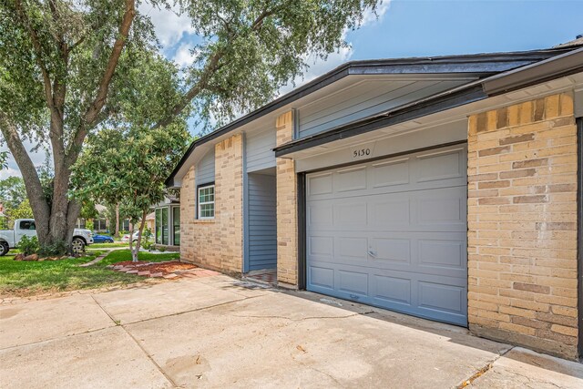 5130 Beaverhollow Dr, Houston, TX 77084 - garage with concrete driveway