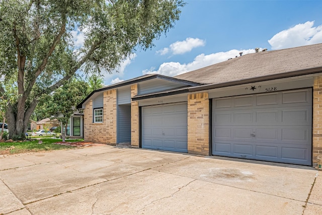 5130 Beaverhollow Dr, Houston, TX 77084 - view of front of house featuring brick siding, driveway, and an attached garage