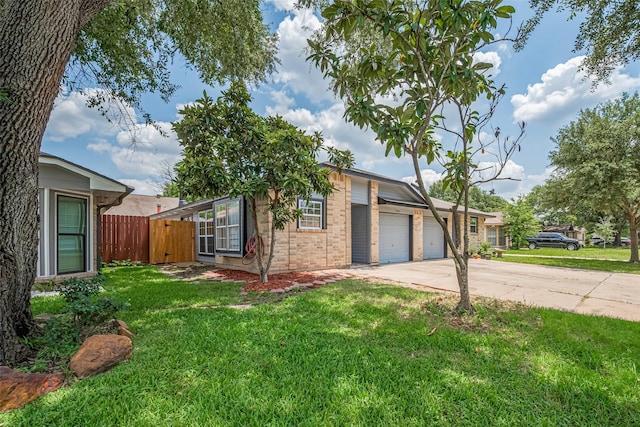 5130 Beaverhollow Dr, Houston, TX 77084 - view of front of house with an attached garage, driveway, and brick siding