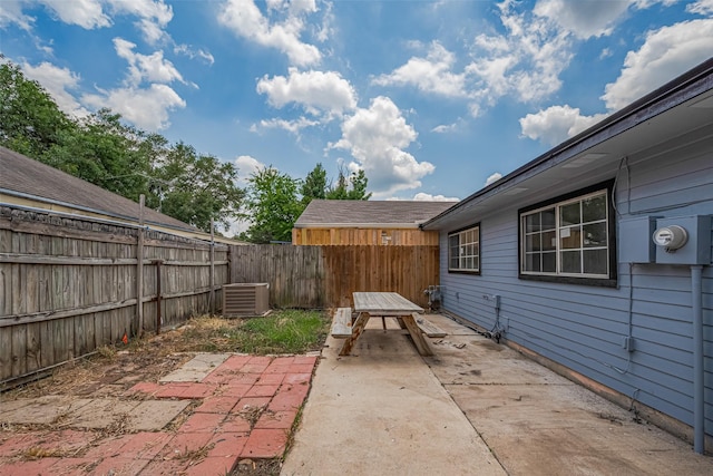 5130 Beaverhollow Dr, Houston, TX 77084 - fenced backyard featuring a patio area and central air condition unit