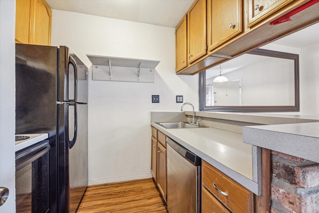 1849 Marshall St Unit 1, Houston, TX 77098 - kitchen featuring stainless steel dishwasher, electric stove, a sink, light wood-style floors, and baseboards