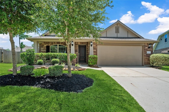 18934 Sorrento Point Dr, New Caney, TX 77357 - view of front of home with a garage, concrete driveway, brick siding, and stucco siding