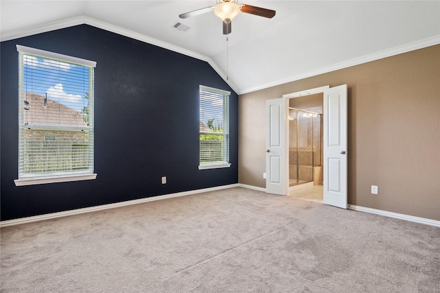 18934 Sorrento Point Dr, New Caney, TX 77357 - unfurnished bedroom featuring vaulted ceiling, carpet, baseboards, ensuite bath, and a ceiling fan